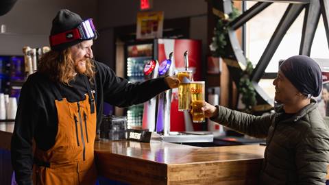 two people drinking coors light beers