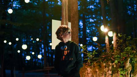 A young boy exploring AGORA: Path of Light