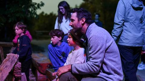 A young family viewing AGORA: Path of Light