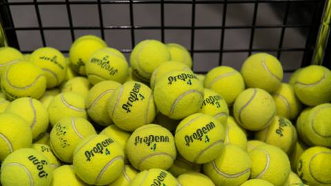 basket filled with tennis balls