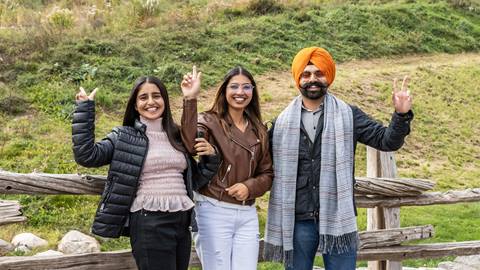 a family waving at the camera at Blue Mountain Resort