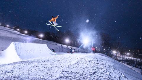 A skier going off a big air jump