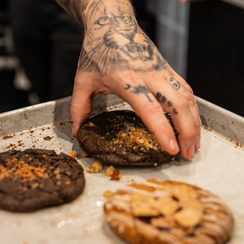 a person picking up a death cookie